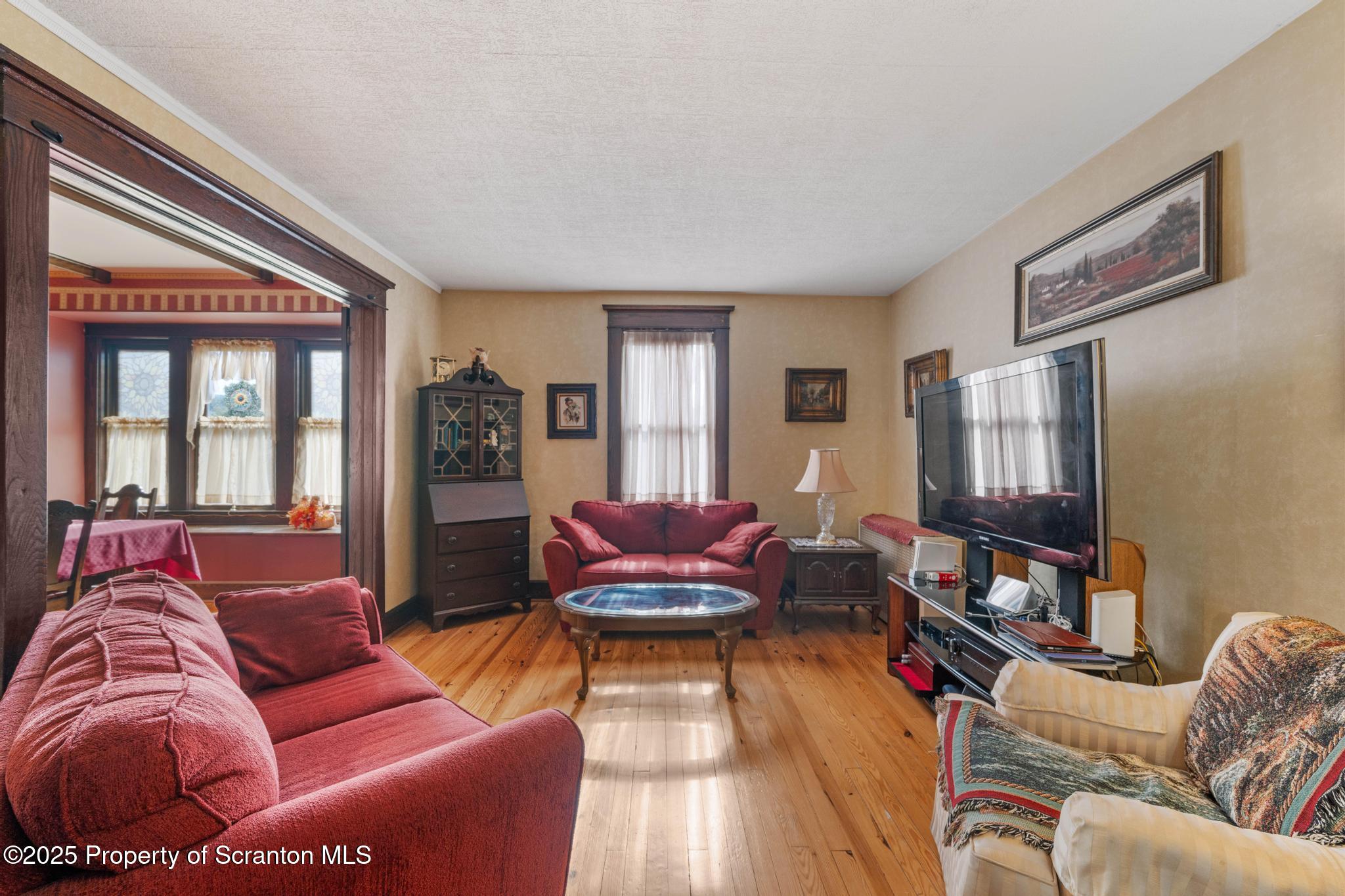 216 Maple Avenue Clarks Summit, PA 18411 - Photo 11 of 51 a living room with furniture and a window