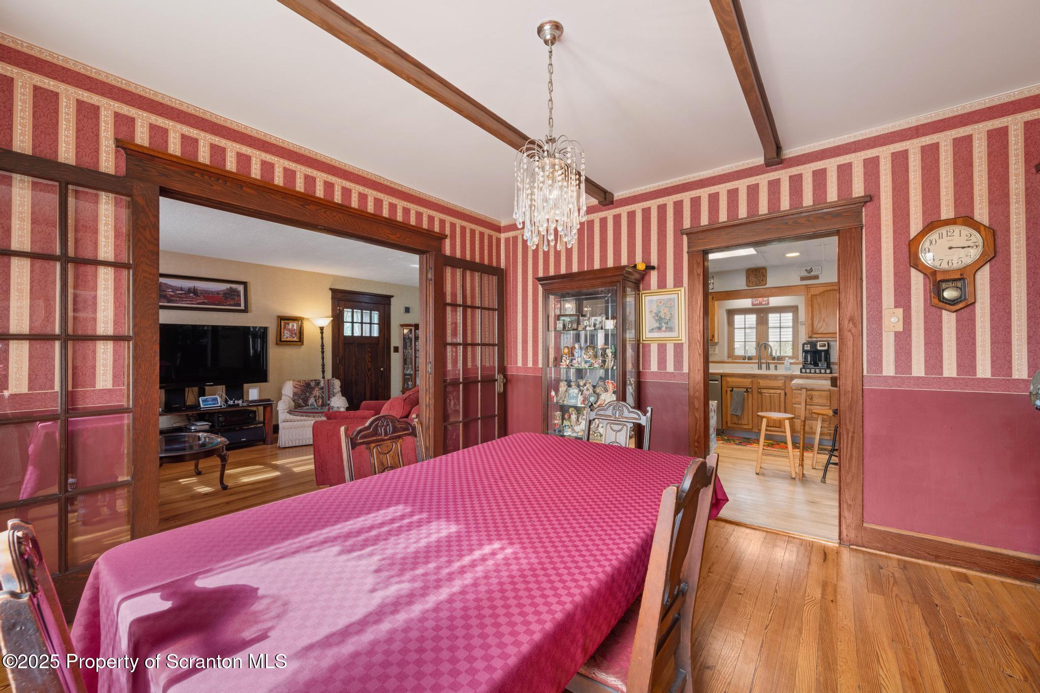 216 Maple Avenue Clarks Summit, PA 18411 - Photo 13 of 51 a large bedroom with a bed and wooden floor