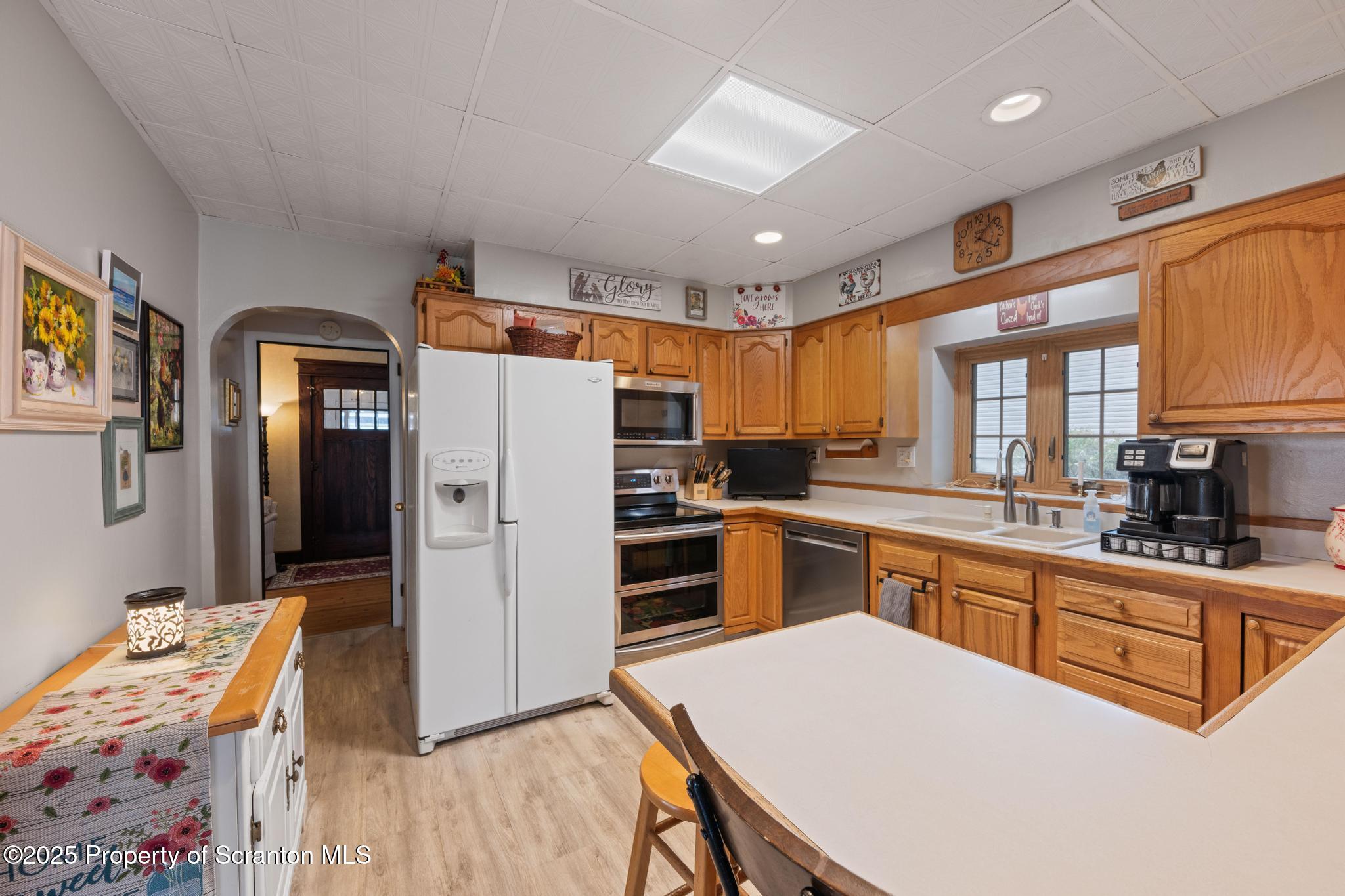 216 Maple Avenue Clarks Summit, PA 18411 - Photo 20 of 51 a large kitchen with stainless steel appliances granite countertop a stove refrigerator and a cabinets