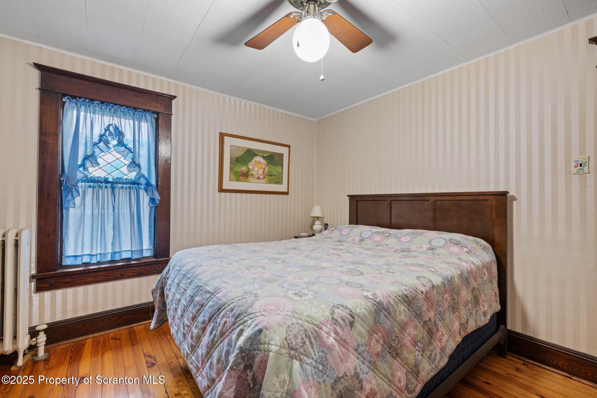 216 Maple Avenue Clarks Summit, PA 18411 - Photo 23 of 51 a bedroom with a bed and a painting on the wall