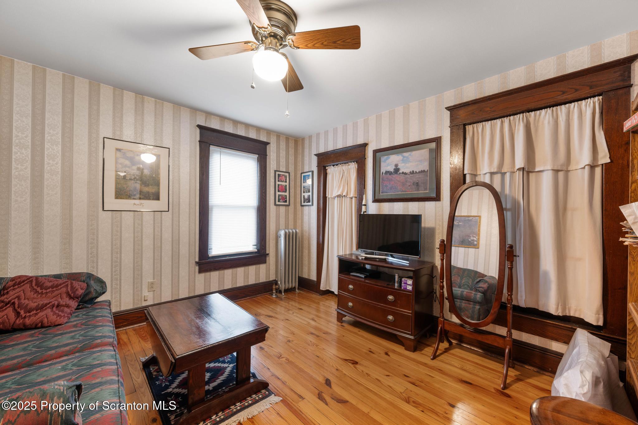 216 Maple Avenue Clarks Summit, PA 18411 - Photo 27 of 51 a living room with furniture and a flat screen tv