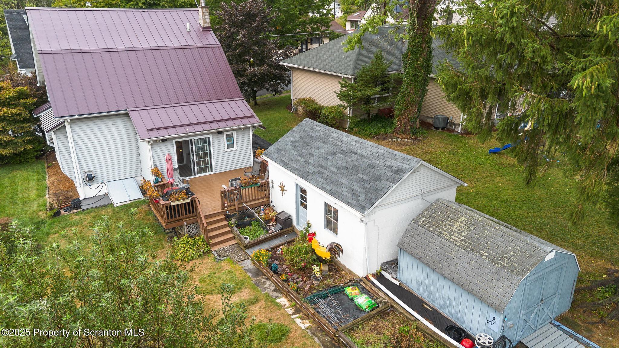 216 Maple Avenue Clarks Summit, PA 18411 - Photo 49 of 51 a aerial view of a house with table and chairs in a patio
