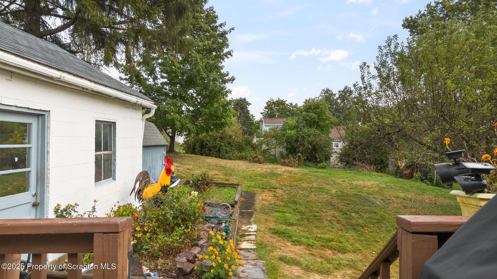 216 Maple Avenue Clarks Summit, PA 18411 - Photo 51 of 51 a view of a backyard with plants and a patio