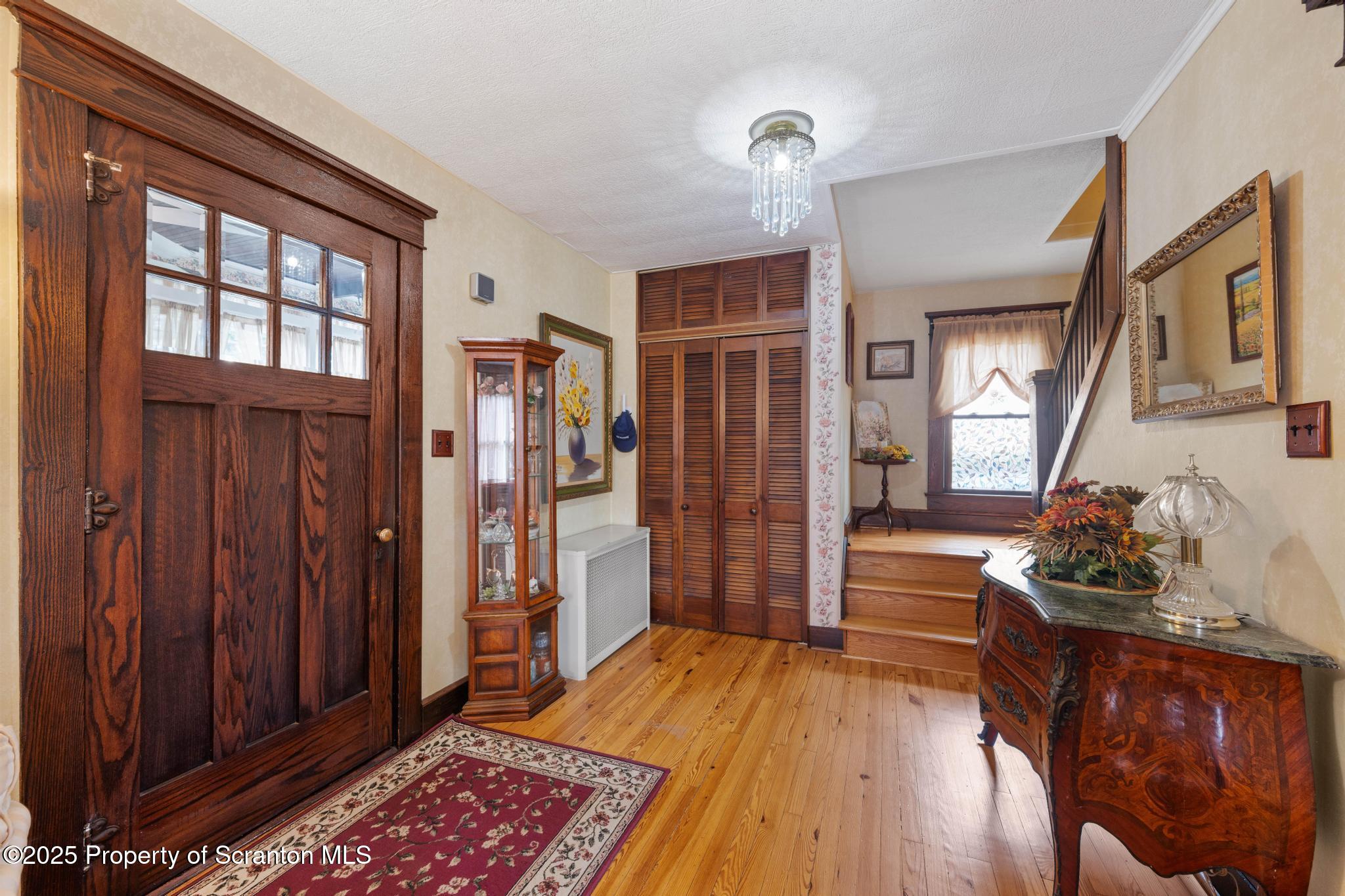 216 Maple Avenue Clarks Summit, PA 18411 - Photo 6 of 51 a room with wooden floor and furniture