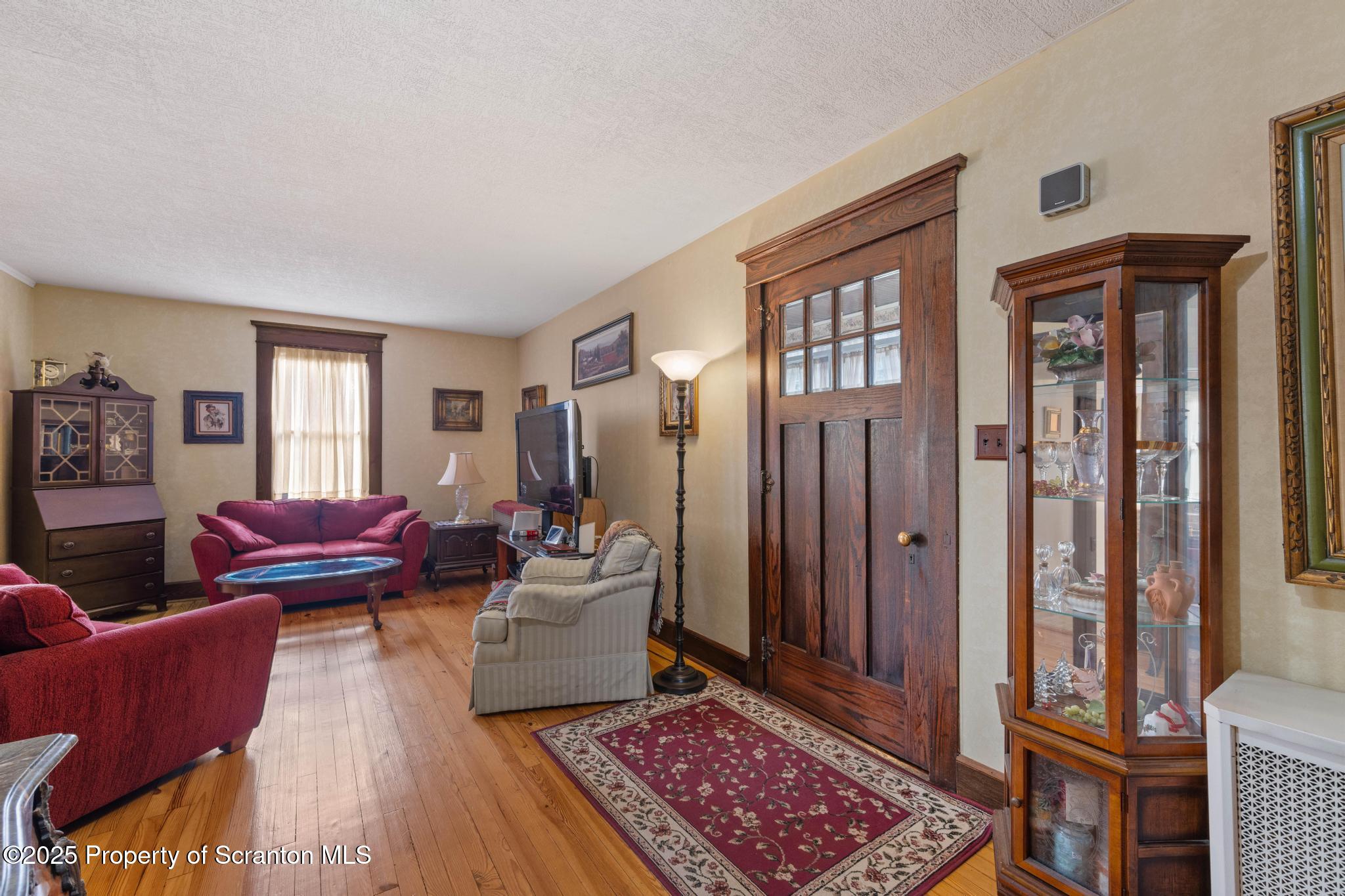 216 Maple Avenue Clarks Summit, PA 18411 - Photo 10 of 51 a living room with furniture and a rug