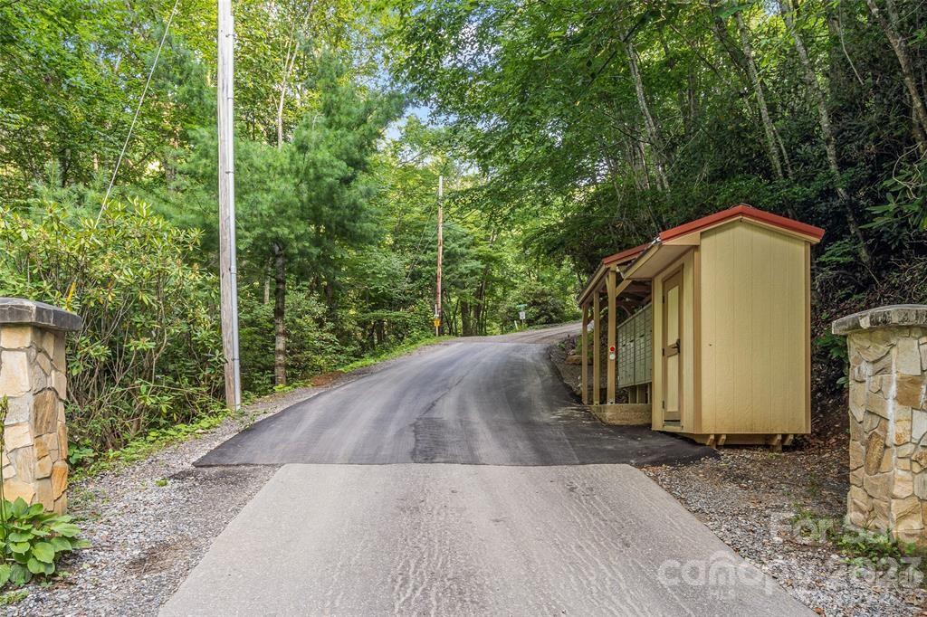 99999 Pioneer Ridge Road, Unit 56 Canton, NC 28716 - Photo 13 of 25 a view of a house with a yard