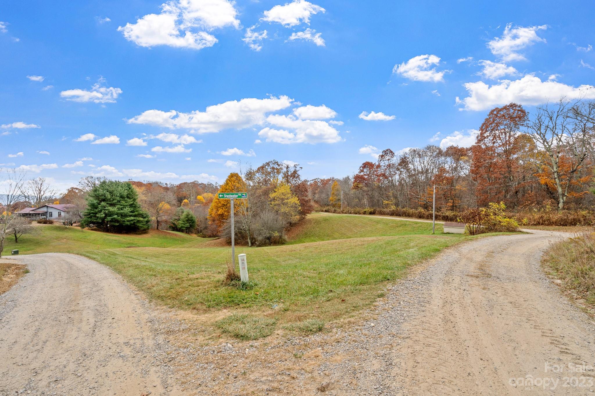 99999 Pioneer Ridge Road, Unit 56 Canton, NC 28716 - Photo 2 of 25 a view of a golf course with a lake