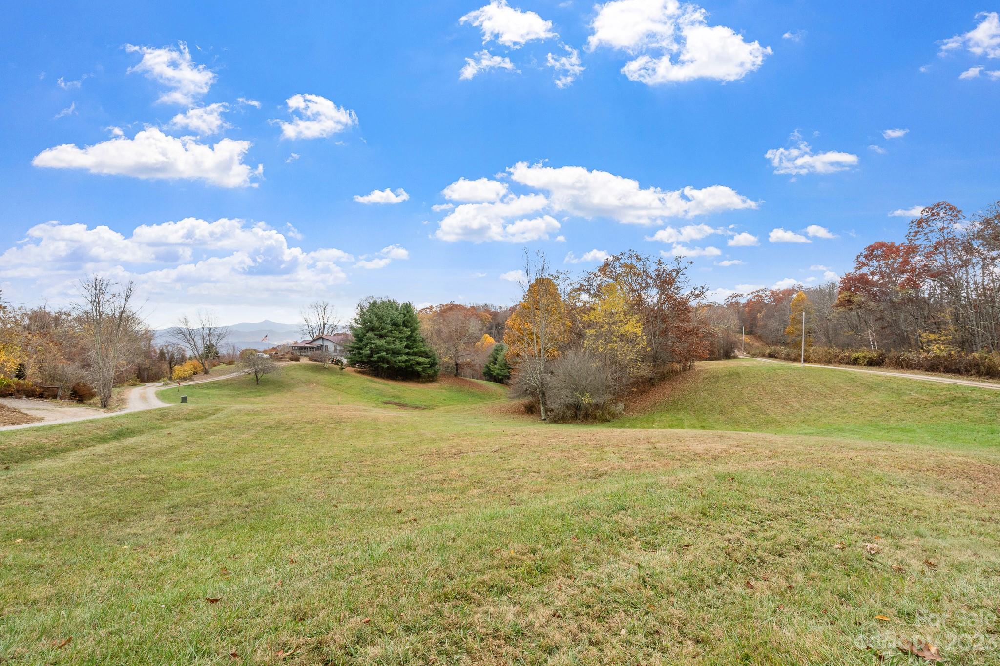 99999 Pioneer Ridge Road, Unit 56 Canton, NC 28716 - Photo 10 of 25 a view of an ocean and a yard