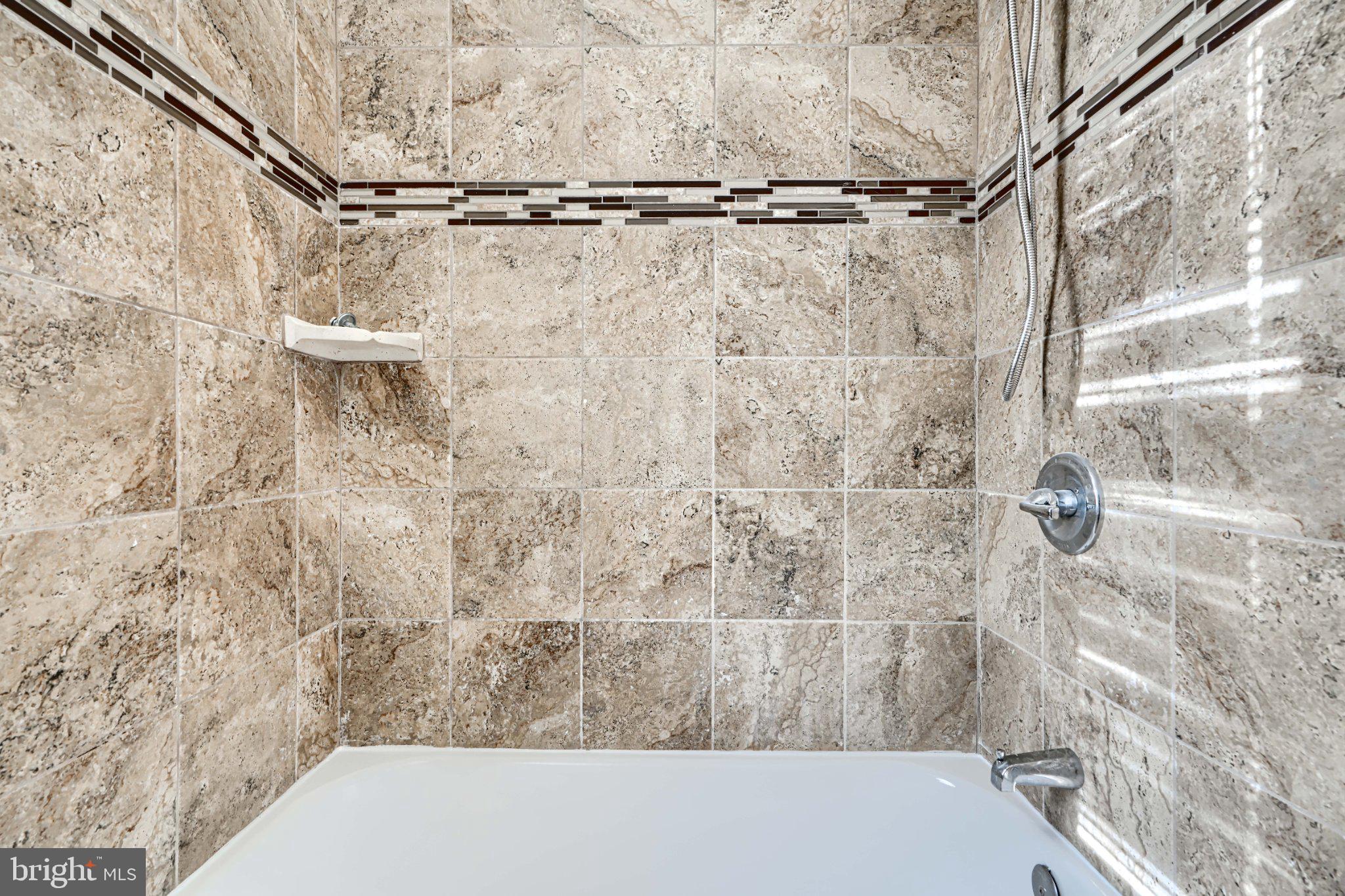 3414 Alto Road, Unit 2 Baltimore, MD 21216 - Photo 21 of 26 Elegant tiled shower retreat.