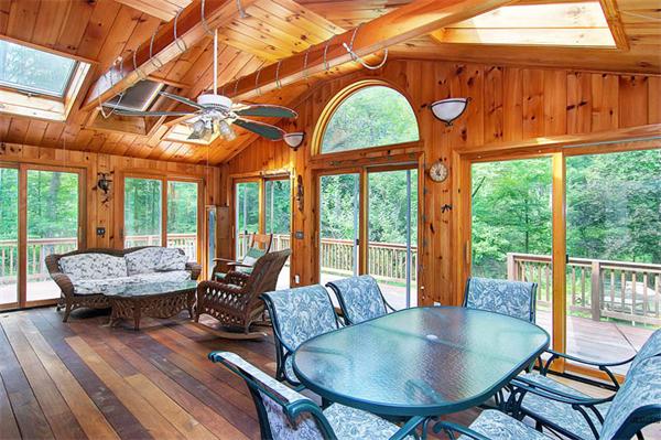 85 Box Mill Road Boxborough, MA 01719 - Photo 11 of 28 a dining room with furniture a chandelier and wooden floor