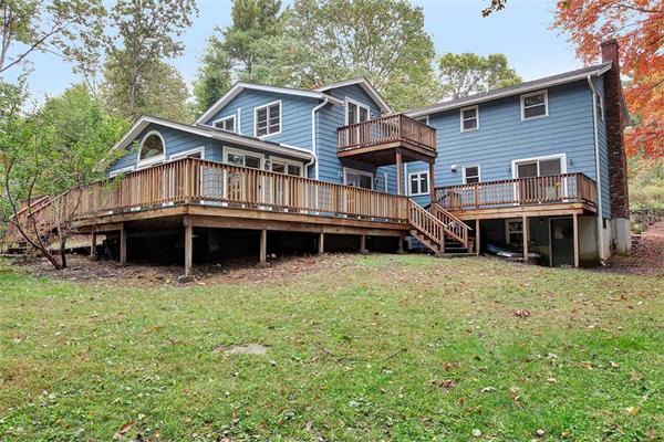85 Box Mill Road Boxborough, MA 01719 - Photo 2 of 28 a front view of a house with a garden and deck