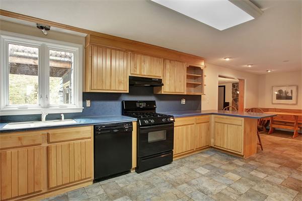 85 Box Mill Road Boxborough, MA 01719 - Photo 5 of 28 a kitchen with granite countertop a stove sink and cabinets