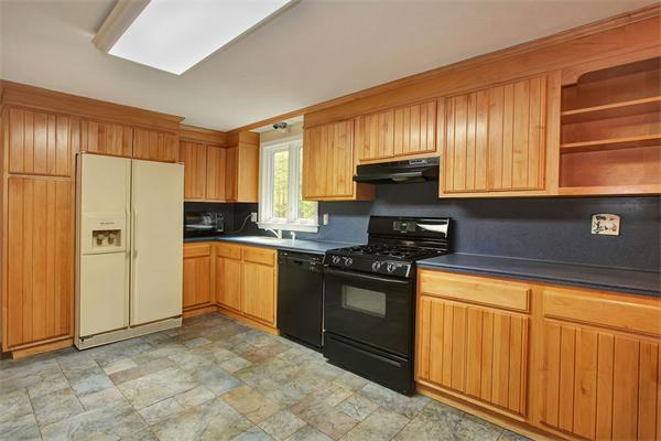 85 Box Mill Road Boxborough, MA 01719 - Photo 6 of 28 a kitchen with granite countertop a stove a sink dishwasher and a refrigerator