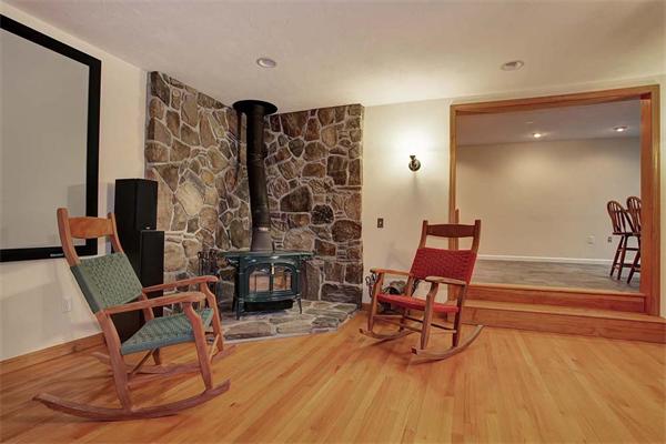 85 Box Mill Road Boxborough, MA 01719 - Photo 9 of 28 a living room with furniture and a fireplace