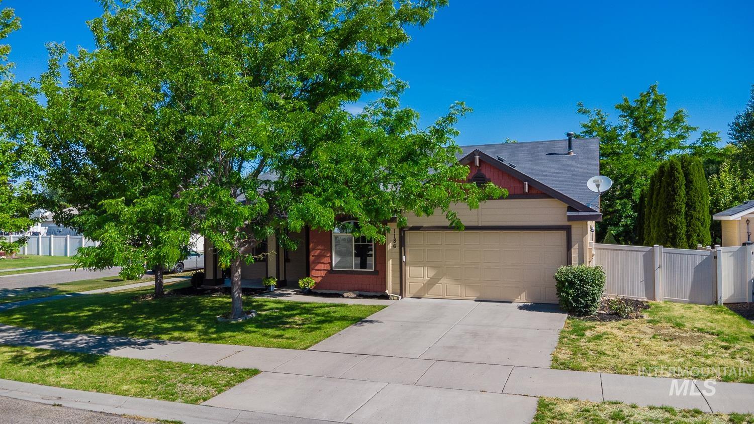 1186 East Observation Street Meridian, ID 83642 - Photo 1 of 33 Single-family residence featuring a two-car garage, concrete driveway, and established front landscaping