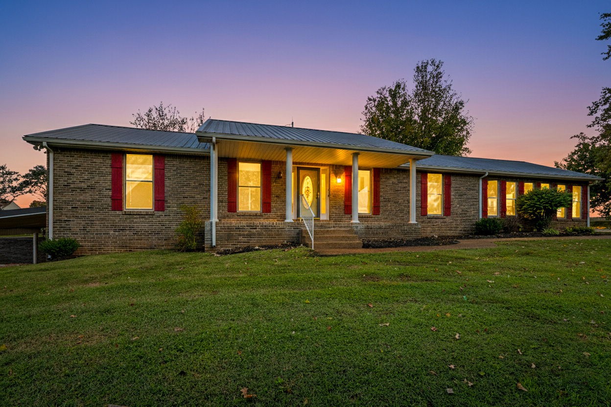 4540 Roy Cole Road Springfield, TN 37172 - Photo 2 of 61 a front view of a house with a garden
