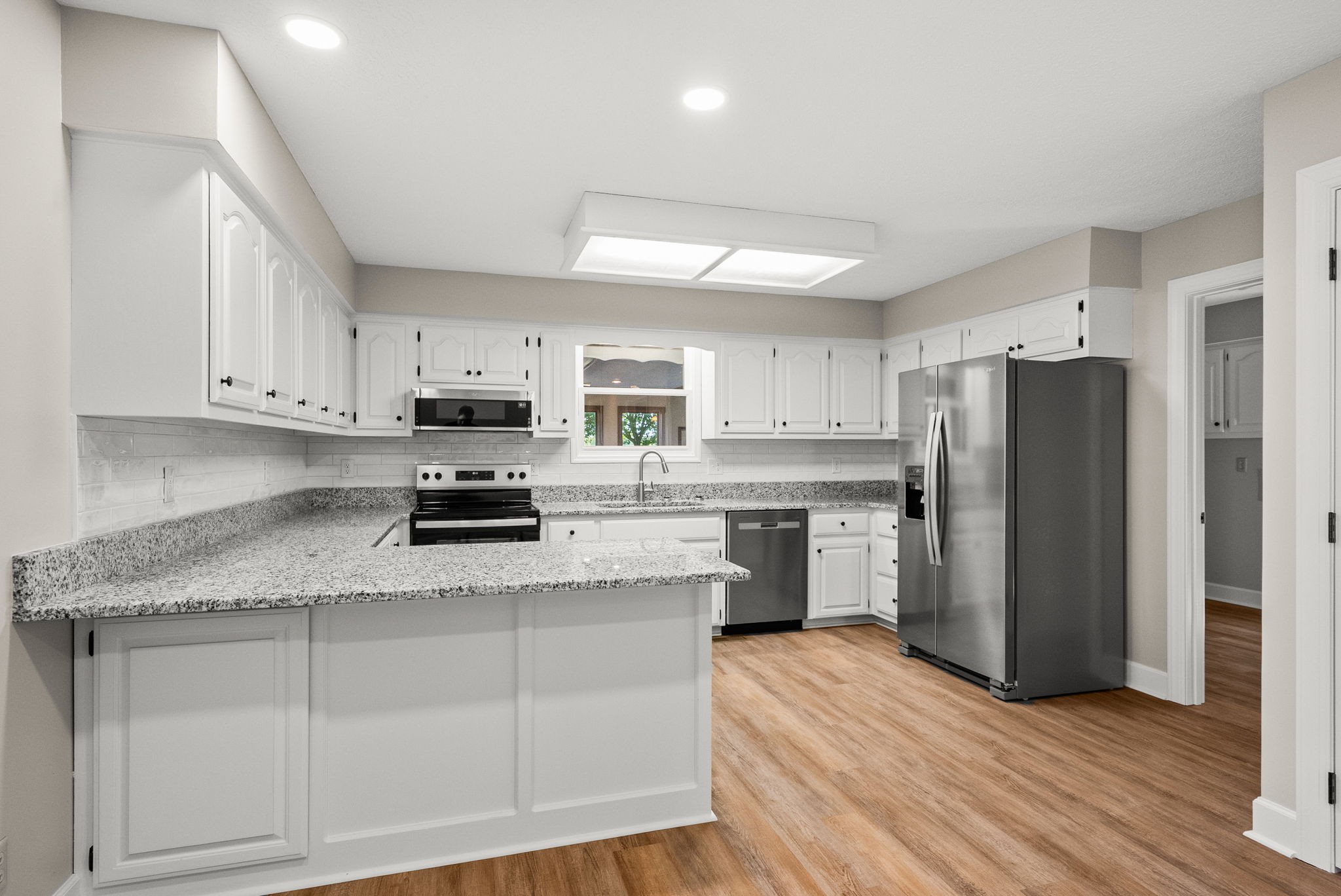 4540 Roy Cole Road Springfield, TN 37172 - Photo 21 of 61 a kitchen with stainless steel appliances granite countertop a refrigerator sink and cabinets