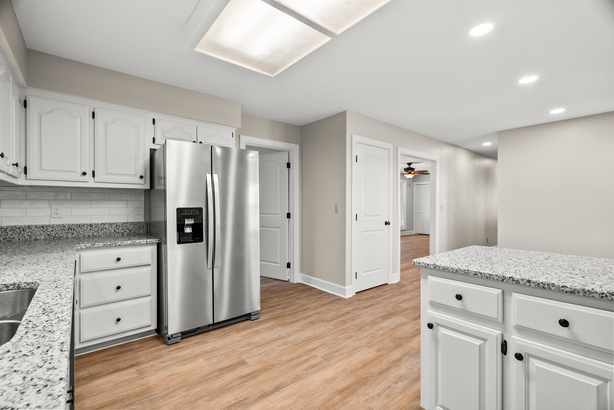 4540 Roy Cole Road Springfield, TN 37172 - Photo 24 of 61 a kitchen with granite countertop white cabinets and refrigerator