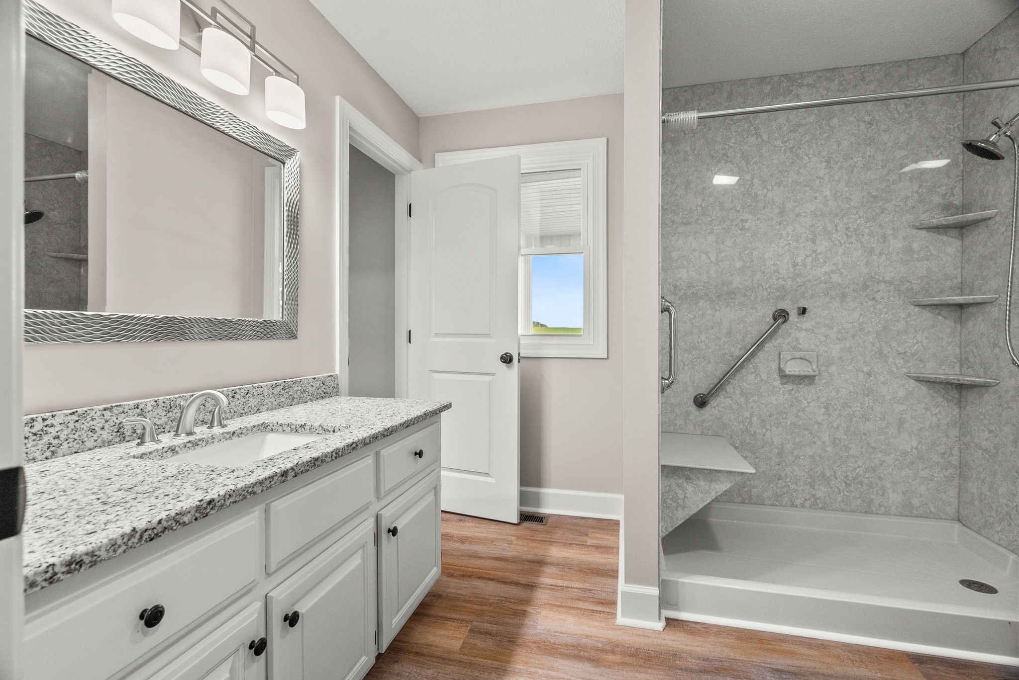 4540 Roy Cole Road Springfield, TN 37172 - Photo 26 of 61 a bathroom with a granite countertop sink mirror and shower