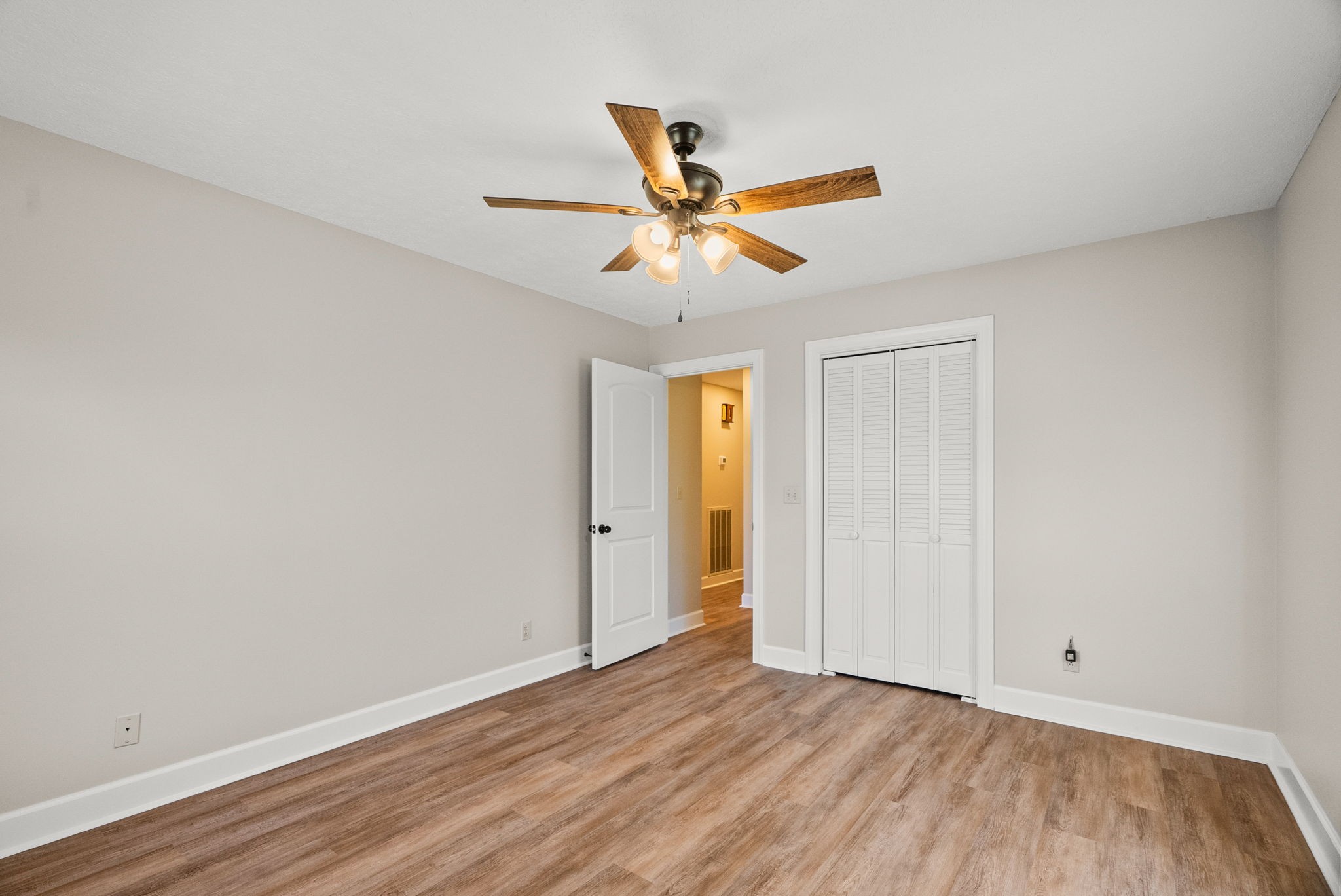 4540 Roy Cole Road Springfield, TN 37172 - Photo 28 of 61 a view of a room with wooden floor and a ceiling fan