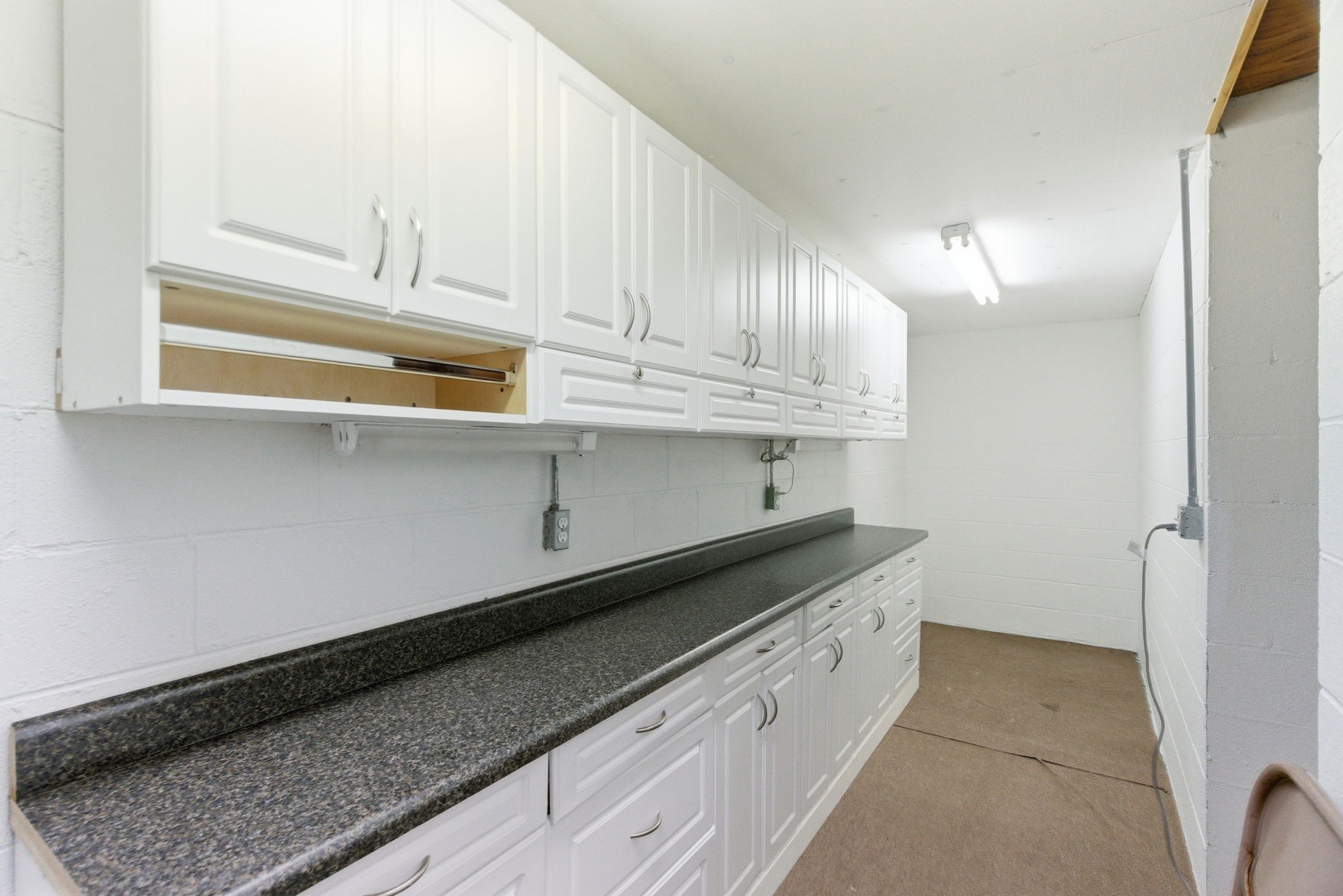 4540 Roy Cole Road Springfield, TN 37172 - Photo 36 of 61 a kitchen with granite countertop white cabinets and a sink