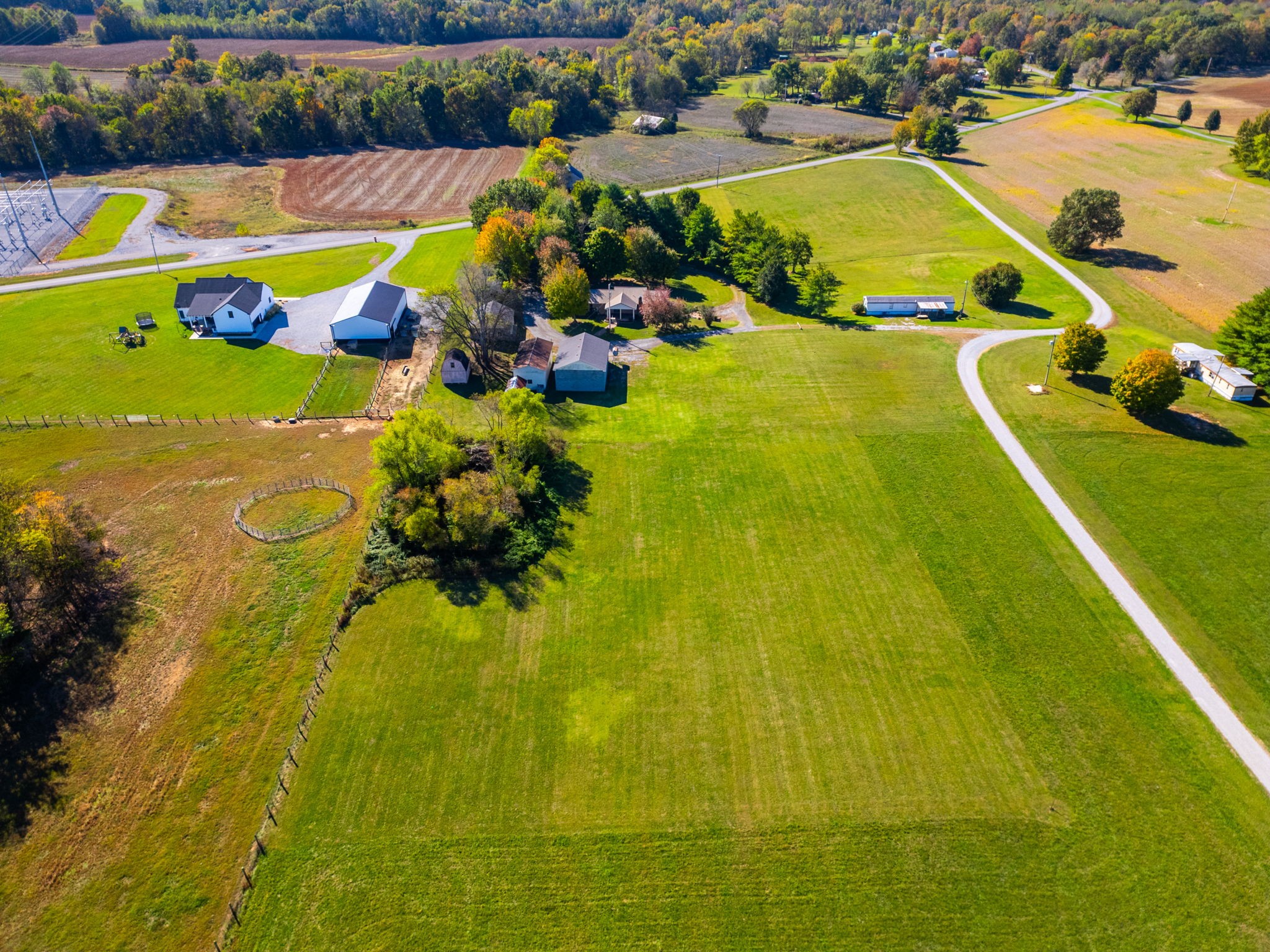 4540 Roy Cole Road Springfield, TN 37172 - Photo 58 of 61 a view of a swimming pool with a lawn chairs under an umbrella