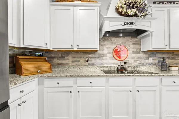 a view of kitchen with furniture and wooden floor