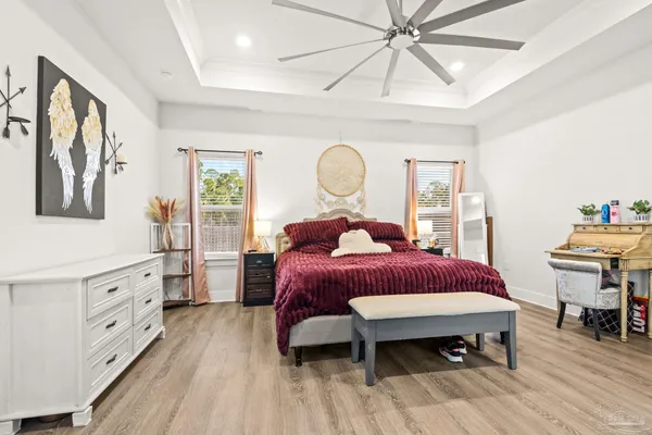 a bathroom with a tub a sink and a mirror
