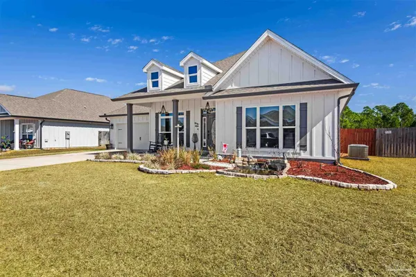 a view of a house with swimming pool and porch
