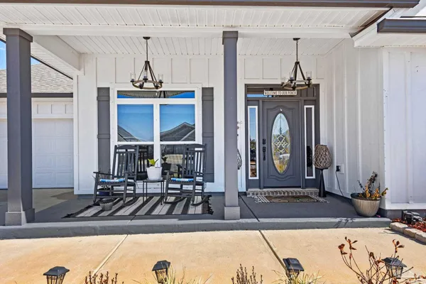 a view of a livingroom with furniture and front door