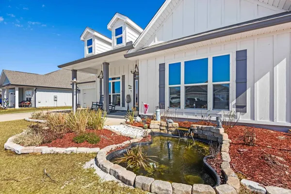 a swimming pool with outdoor seating