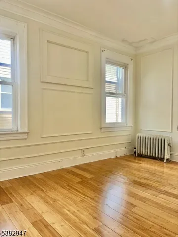 a bathroom with a granite countertop window and a shower