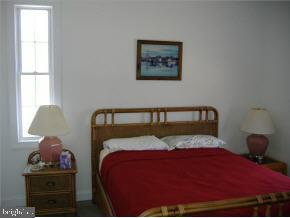 36 Compass Road Waretown, NJ 08758 - Photo 6 of 10 a bedroom with a bed and window
