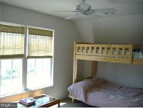 36 Compass Road Waretown, NJ 08758 - Photo 7 of 10 a bedroom with a bed and a window