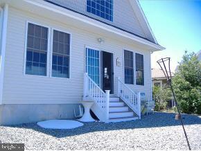 36 Compass Road Waretown, NJ 08758 - Photo 9 of 10 a view of a porch with a rug