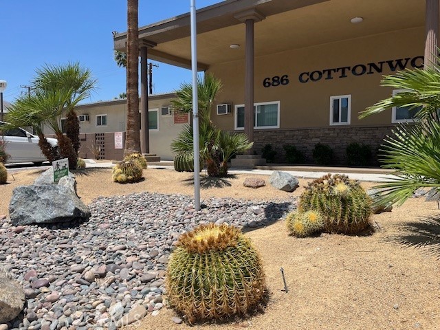 686 East Cottonwood Road, Unit 6 Palm Springs, CA 92262 - Photo 1 of 1 a view of a house with a yard
