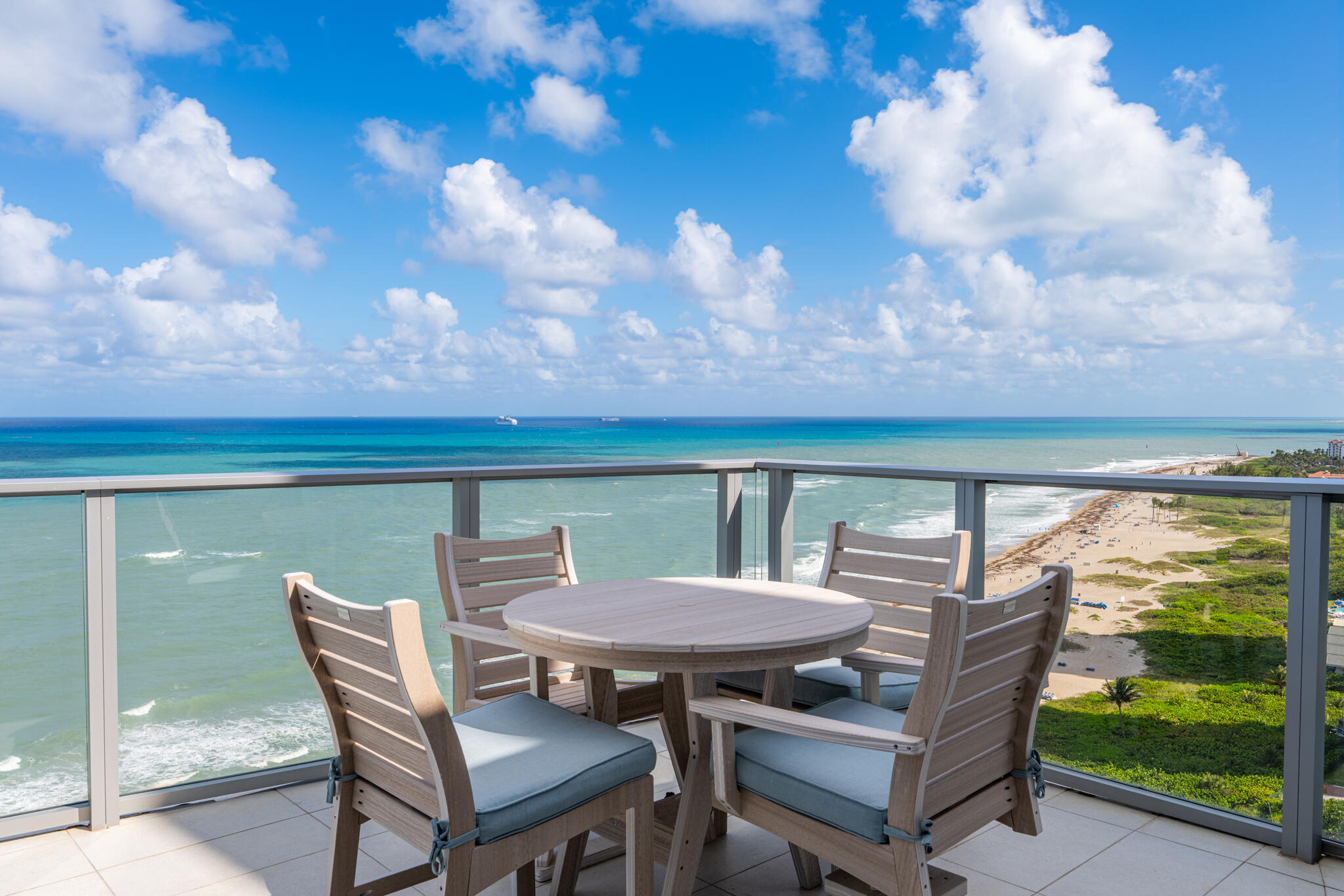 3100 North Ocean Drive, Unit HPH3 Riviera Beach, FL 33404 - Photo 11 of 42 a view of a balcony with table and chairs