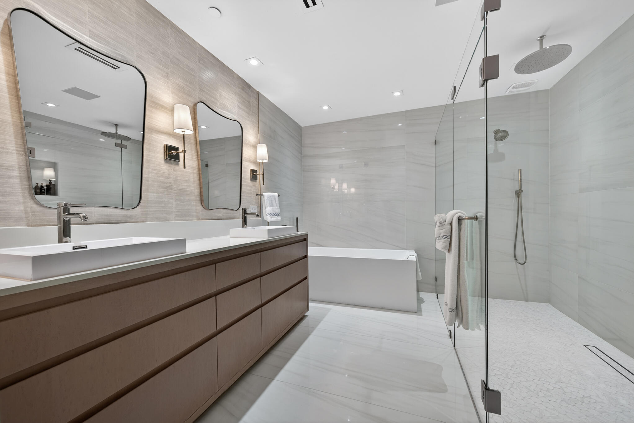 3100 North Ocean Drive, Unit HPH3 Riviera Beach, FL 33404 - Photo 22 of 42 a bathroom with a double vanity sink mirror double and bathtub