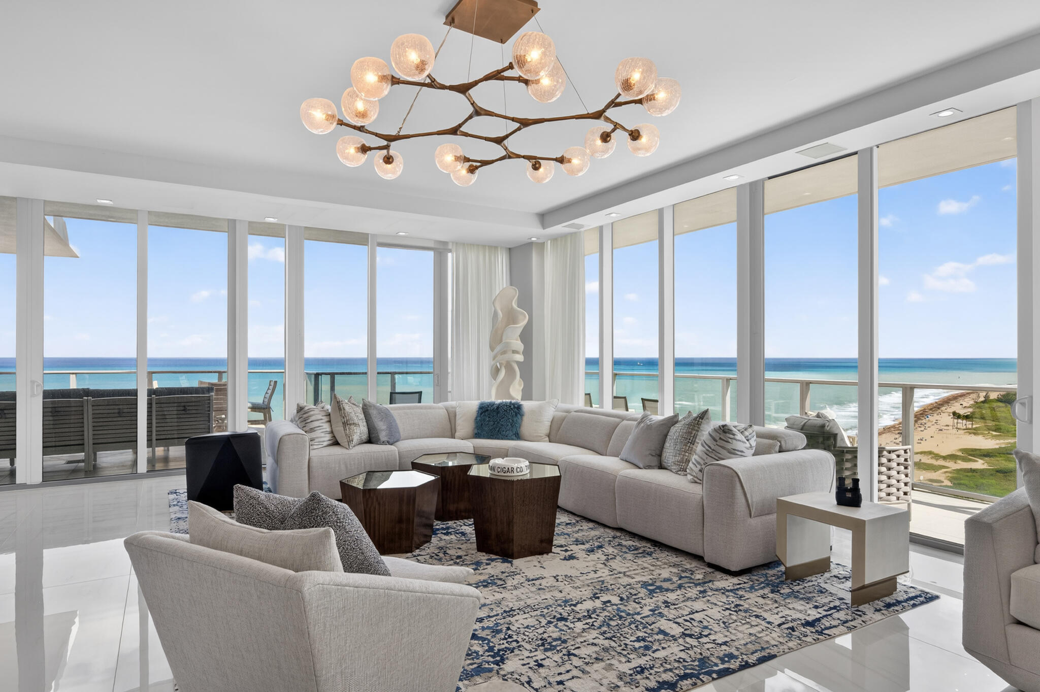 3100 North Ocean Drive, Unit HPH3 Riviera Beach, FL 33404 - Photo 6 of 42 a living room with furniture ceiling fan and a large window