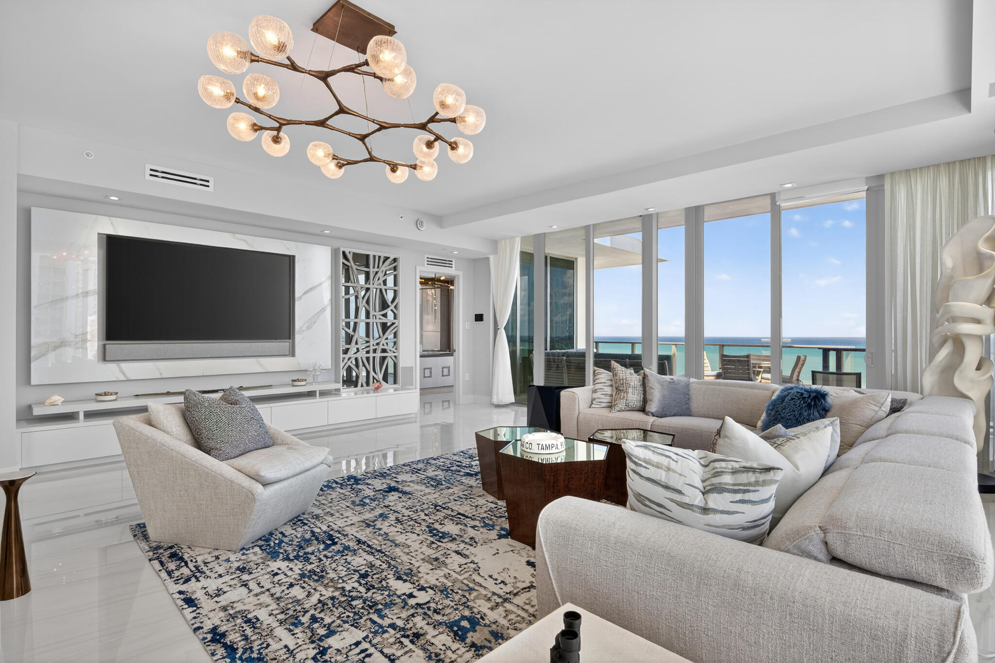 3100 North Ocean Drive, Unit HPH3 Riviera Beach, FL 33404 - Photo 8 of 42 a living room with fireplace furniture and a flat screen tv