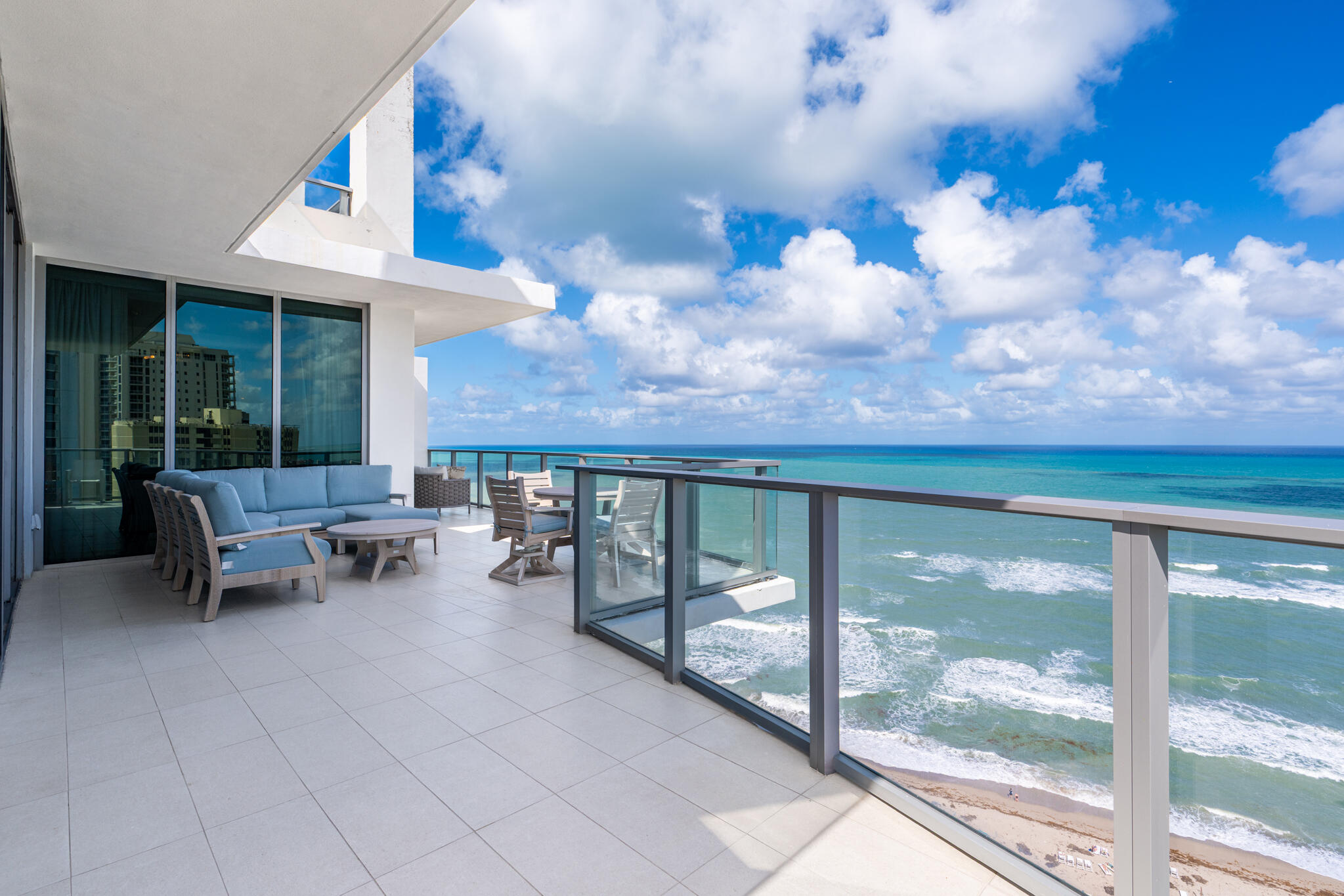 3100 North Ocean Drive, Unit HPH3 Riviera Beach, FL 33404 - Photo 10 of 42 a view of a patio with a dining table and chairs
