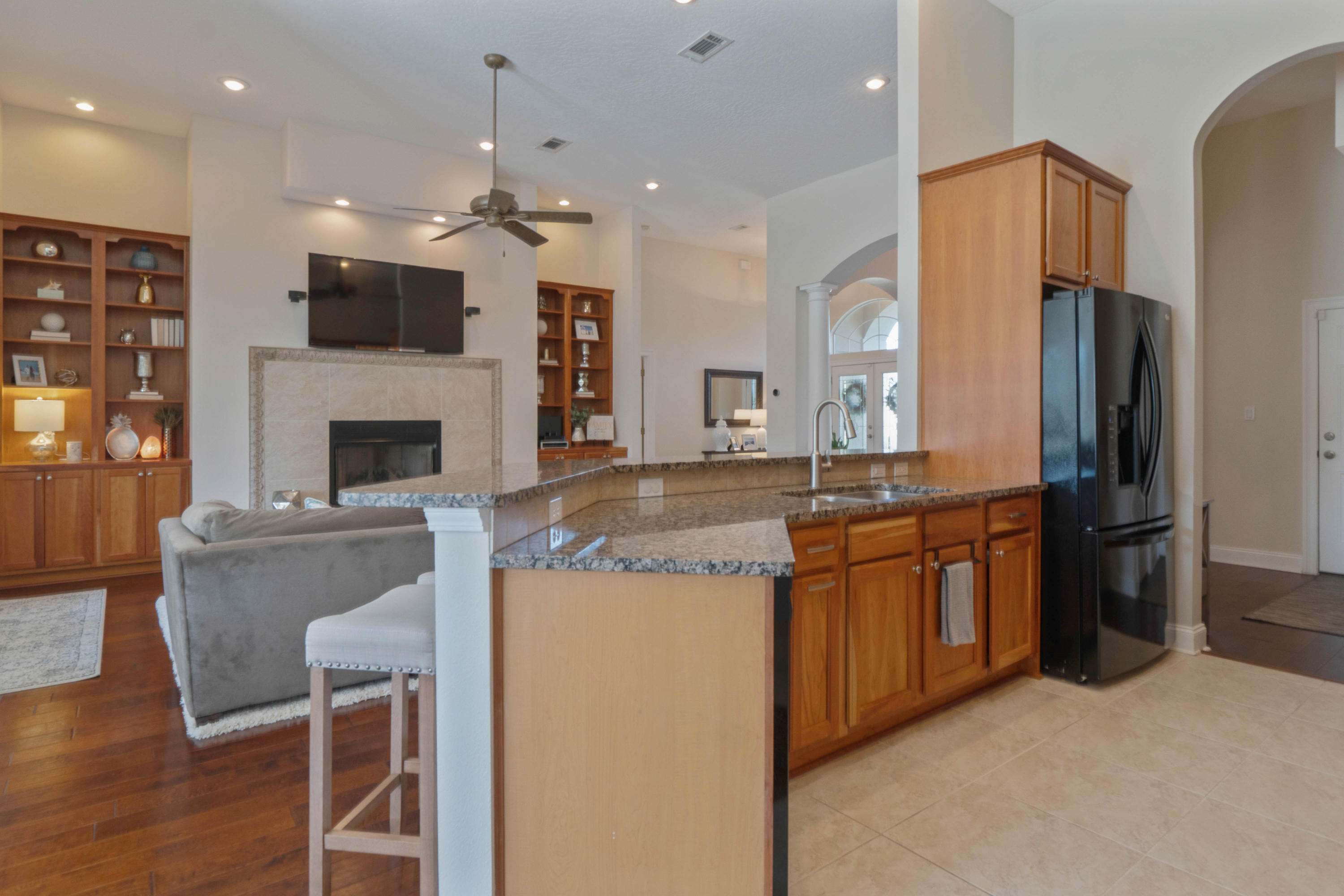 4611 Chanan Drive Crestview, FL 32539 - Photo 15 of 39 a large kitchen with stainless steel appliances kitchen island granite countertop a stove and a refrigerator