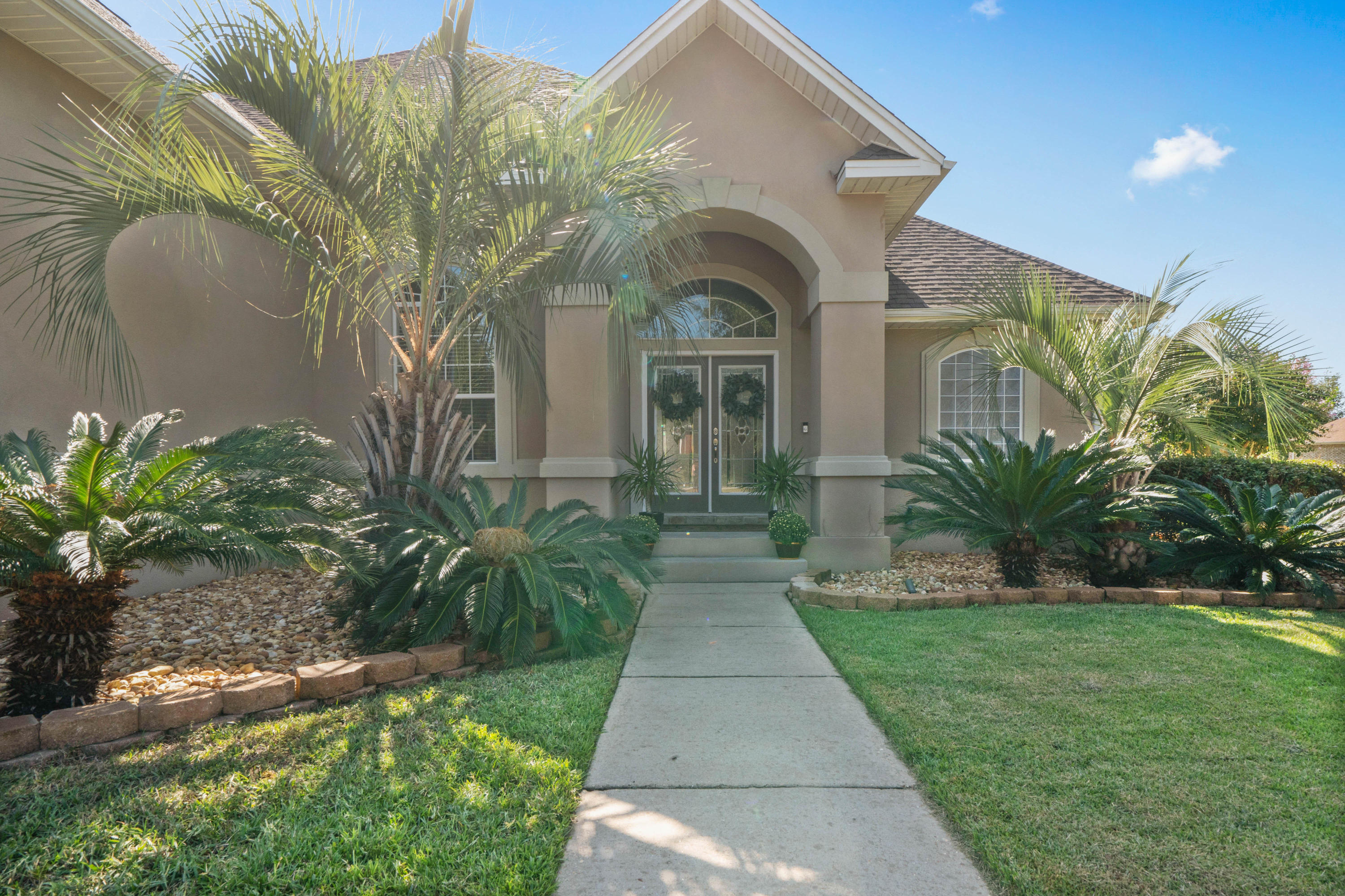 4611 Chanan Drive Crestview, FL 32539 - Photo 2 of 39 a front view of a house with a yard