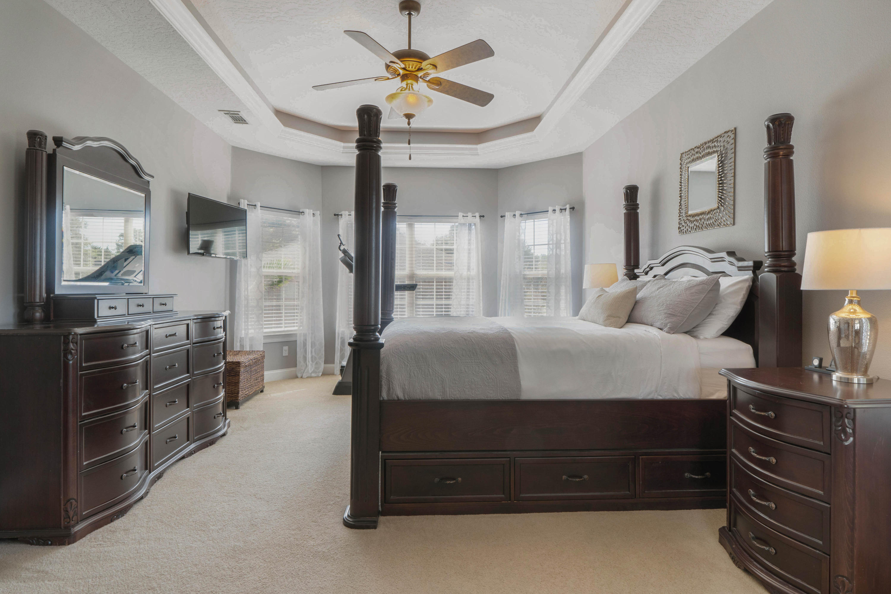 4611 Chanan Drive Crestview, FL 32539 - Photo 22 of 39 a bedroom with a bed and a chandelier