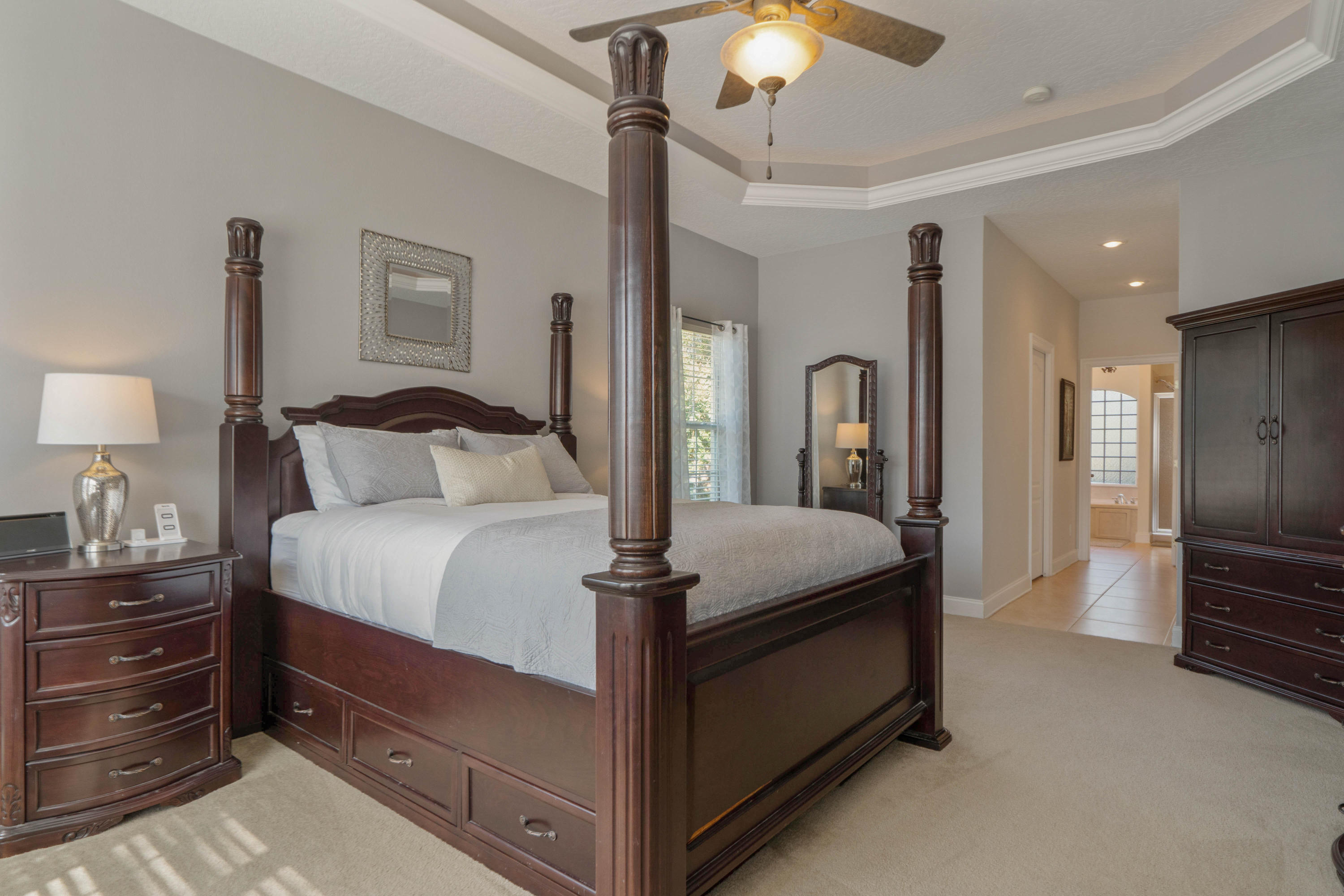 4611 Chanan Drive Crestview, FL 32539 - Photo 23 of 39 a bedroom with a bed and a chandelier