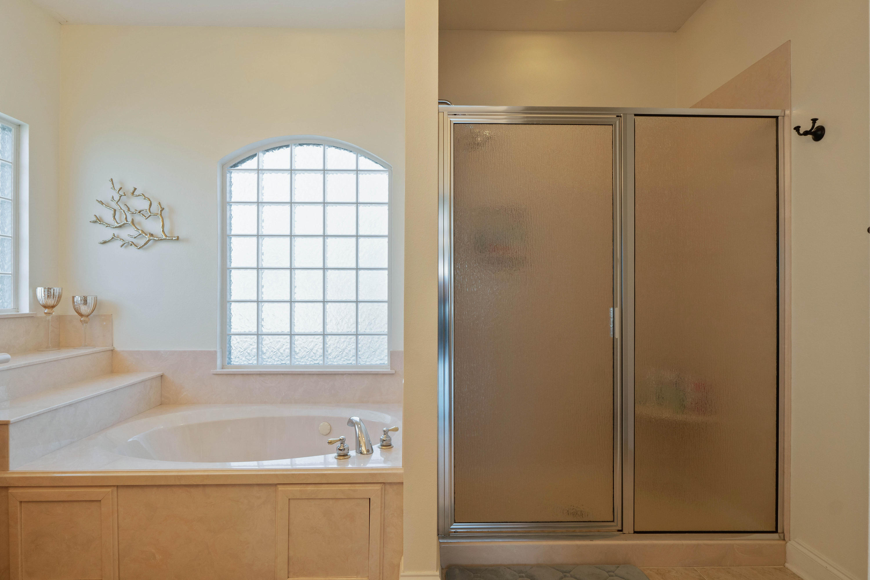 4611 Chanan Drive Crestview, FL 32539 - Photo 25 of 39 a bathroom with a bathtub and a shower