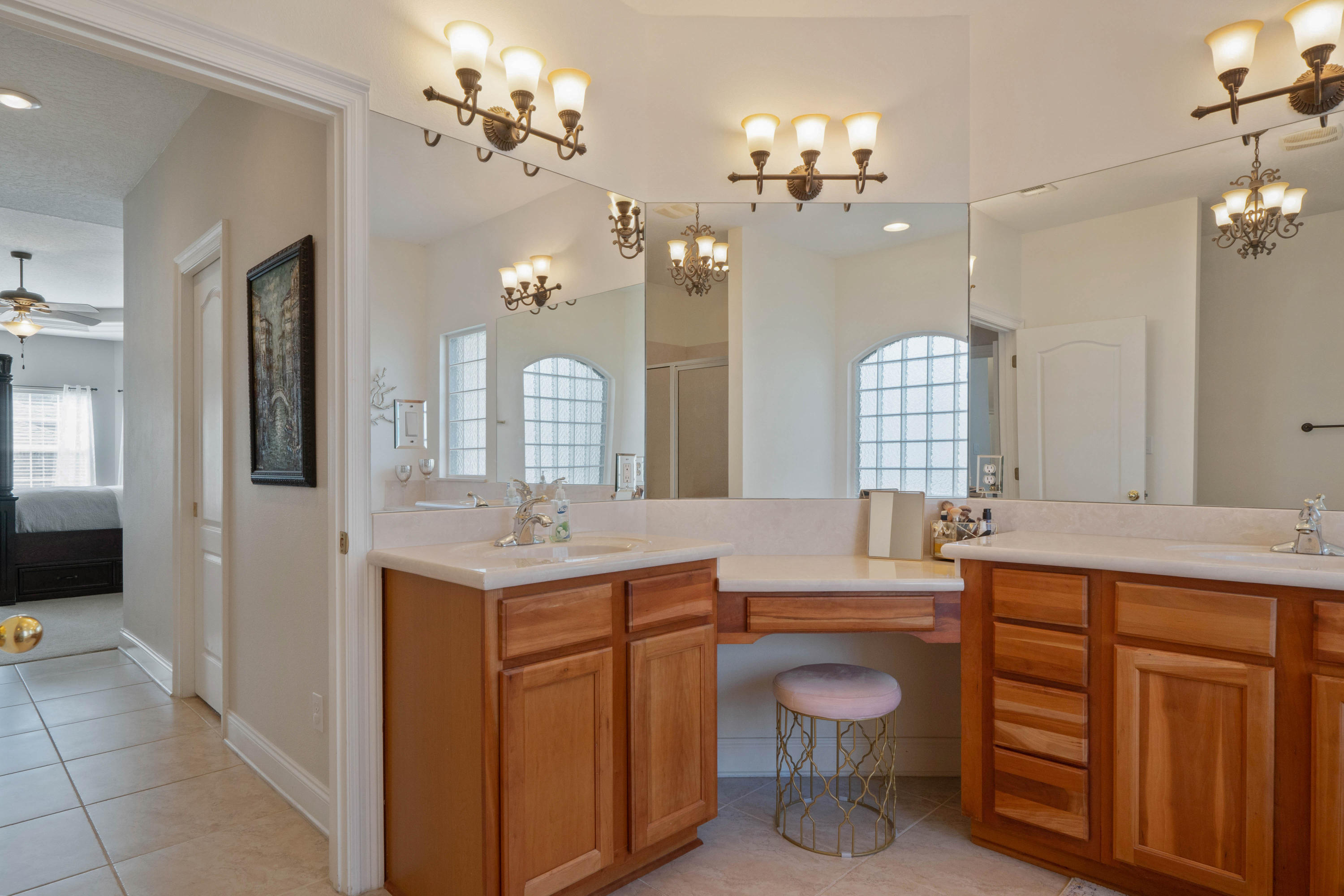 4611 Chanan Drive Crestview, FL 32539 - Photo 27 of 39 a bathroom with a granite countertop sink a toilet and a mirror