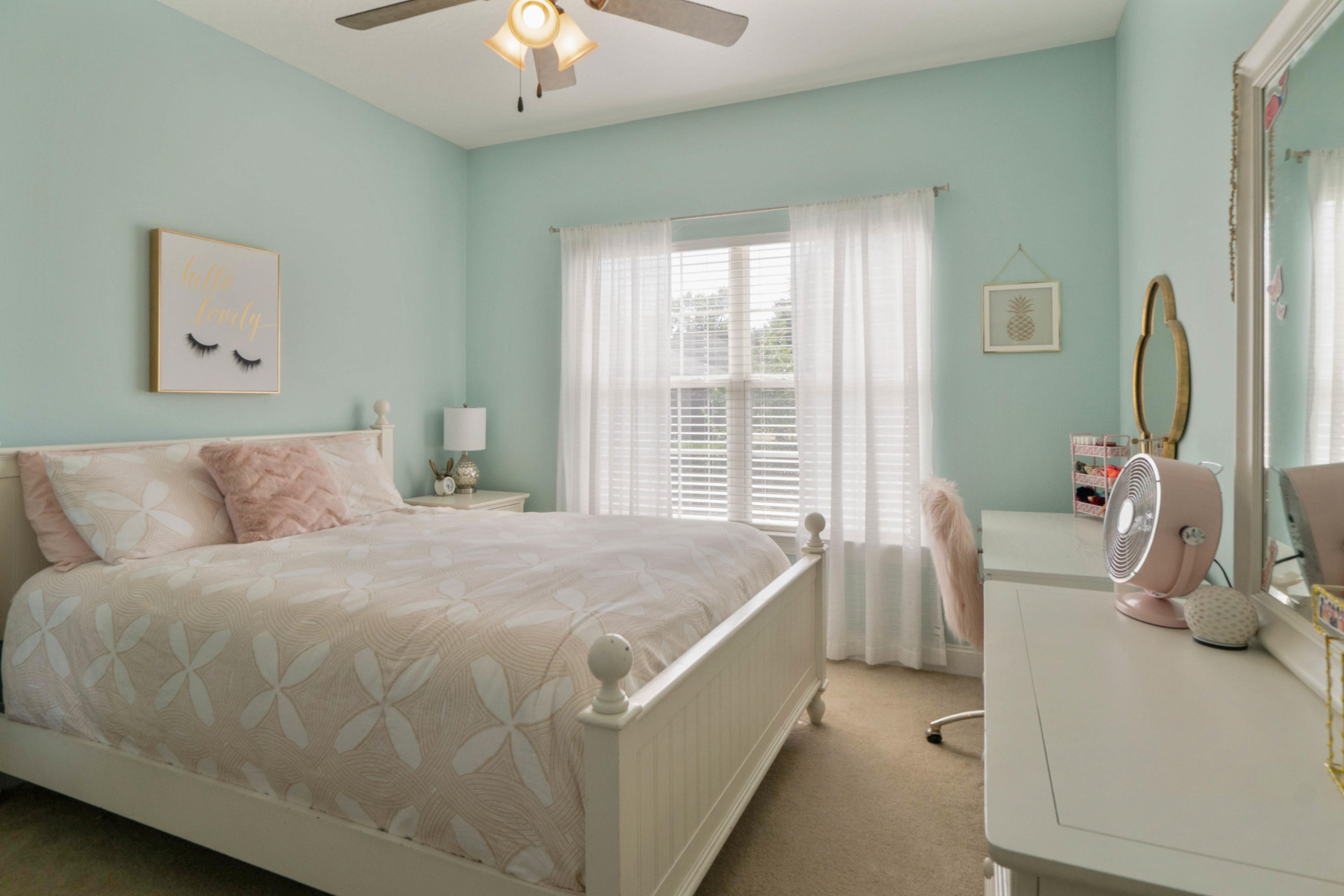 4611 Chanan Drive Crestview, FL 32539 - Photo 28 of 39 a bed room with a bed and a chandelier