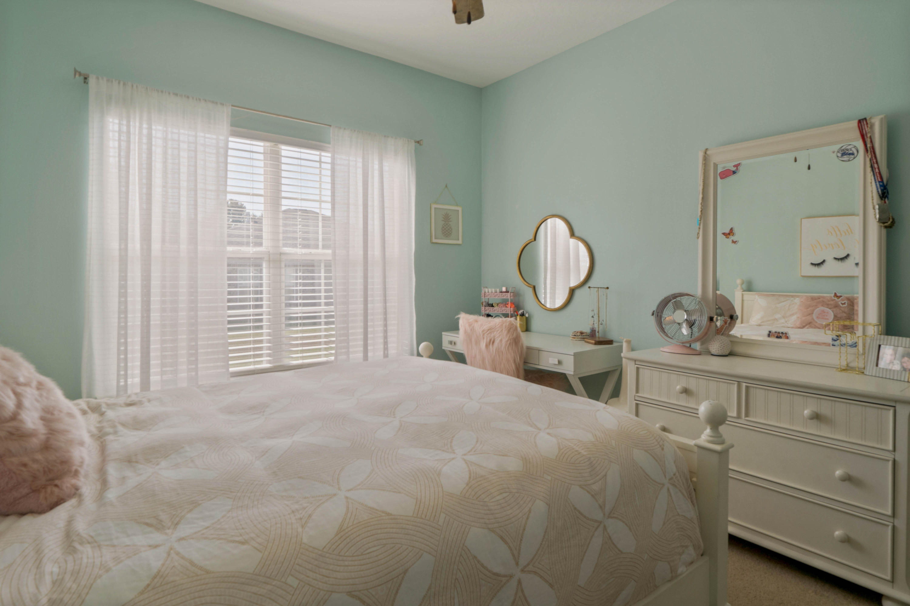 4611 Chanan Drive Crestview, FL 32539 - Photo 29 of 39 a large bed sitting in a bedroom next to a window