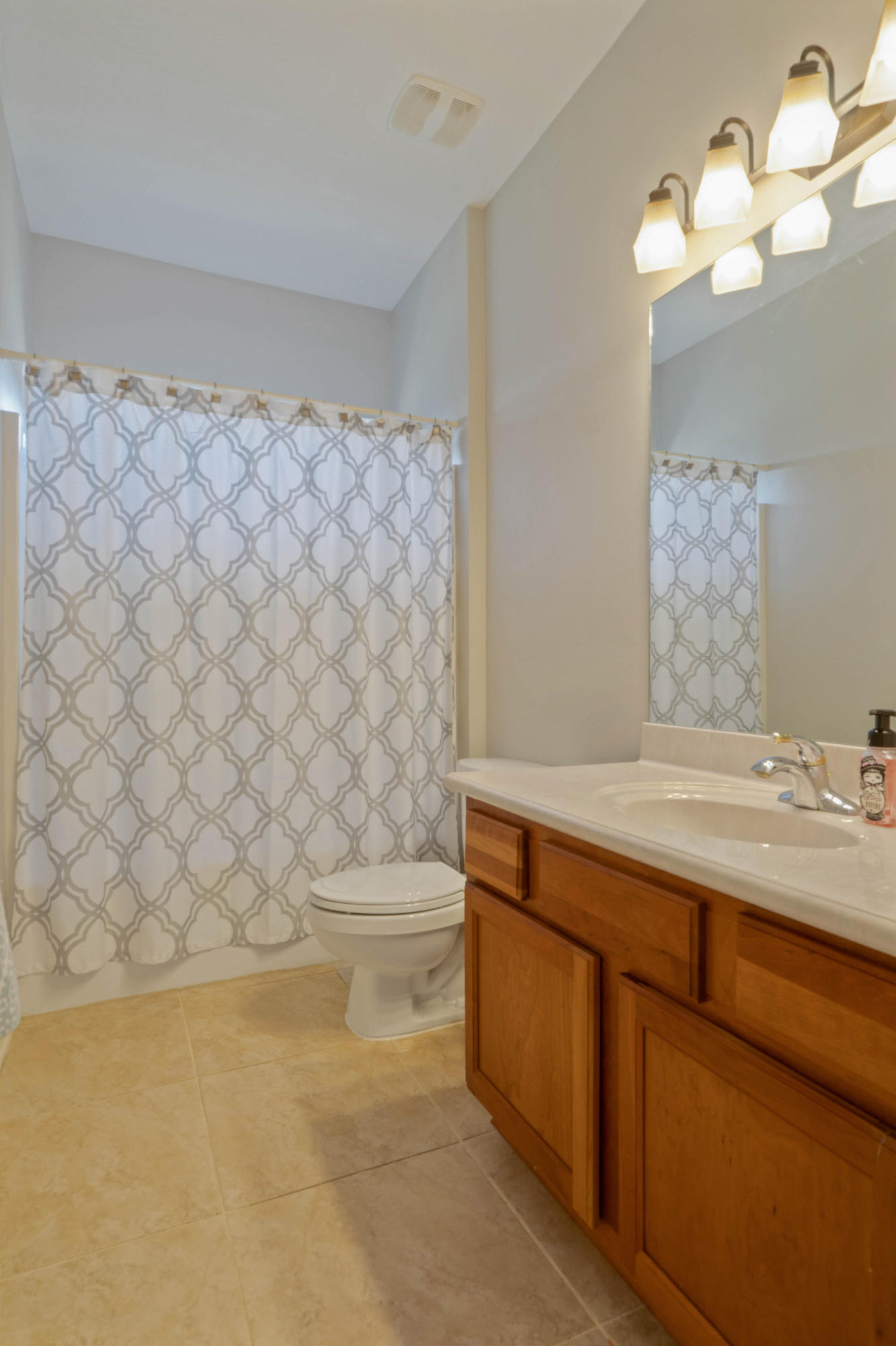 4611 Chanan Drive Crestview, FL 32539 - Photo 30 of 39 a bathroom with a sink a toilet and a mirror